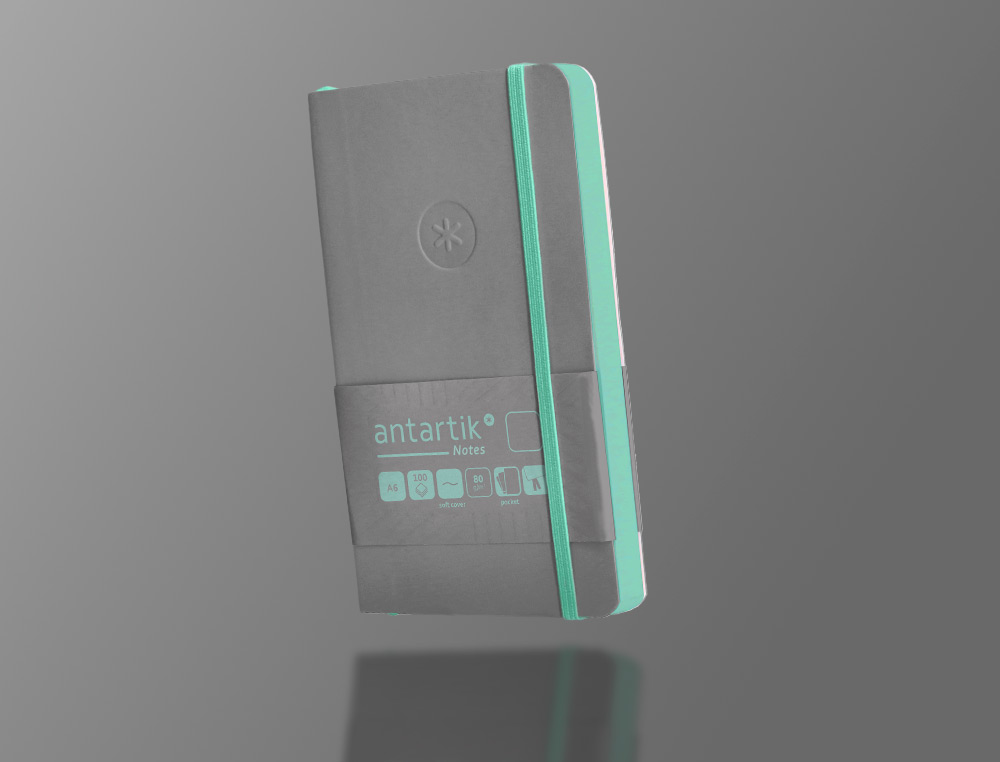 CADERNO COM ELASTICO ANTARTIK NOTES CAPA MOLE A6 LISO CINZA E TURQUESA 100 FOLHAS 80 GR FSC