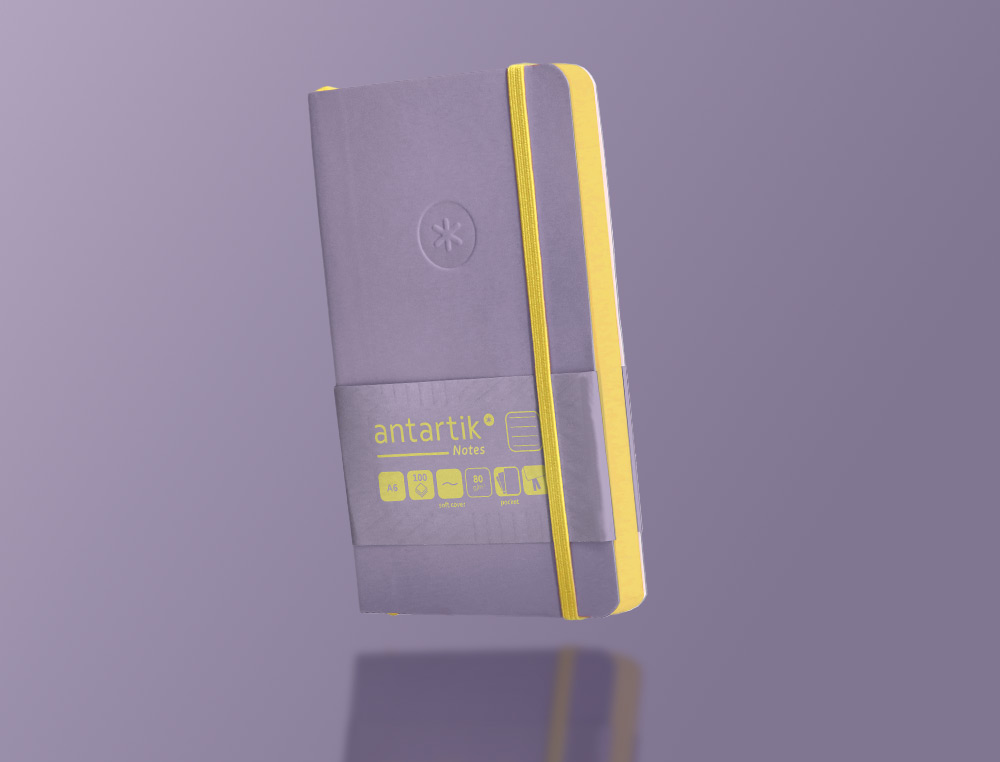 CADERNO COM ELASTICO ANTARTIK NOTES CAPA MOLE A6 PAUTADO ROXO E AMARELO 100 FOLHAS 80 GR FSC